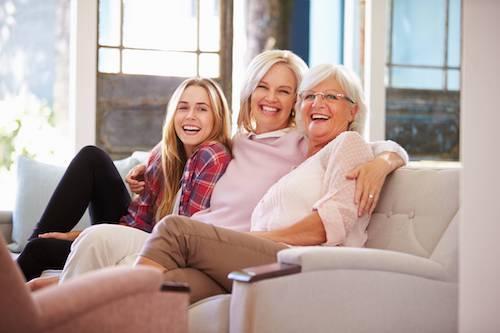 Family resting after getting invisible braces from CS Family Dentistry
